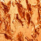 Flying copper coloured leaf