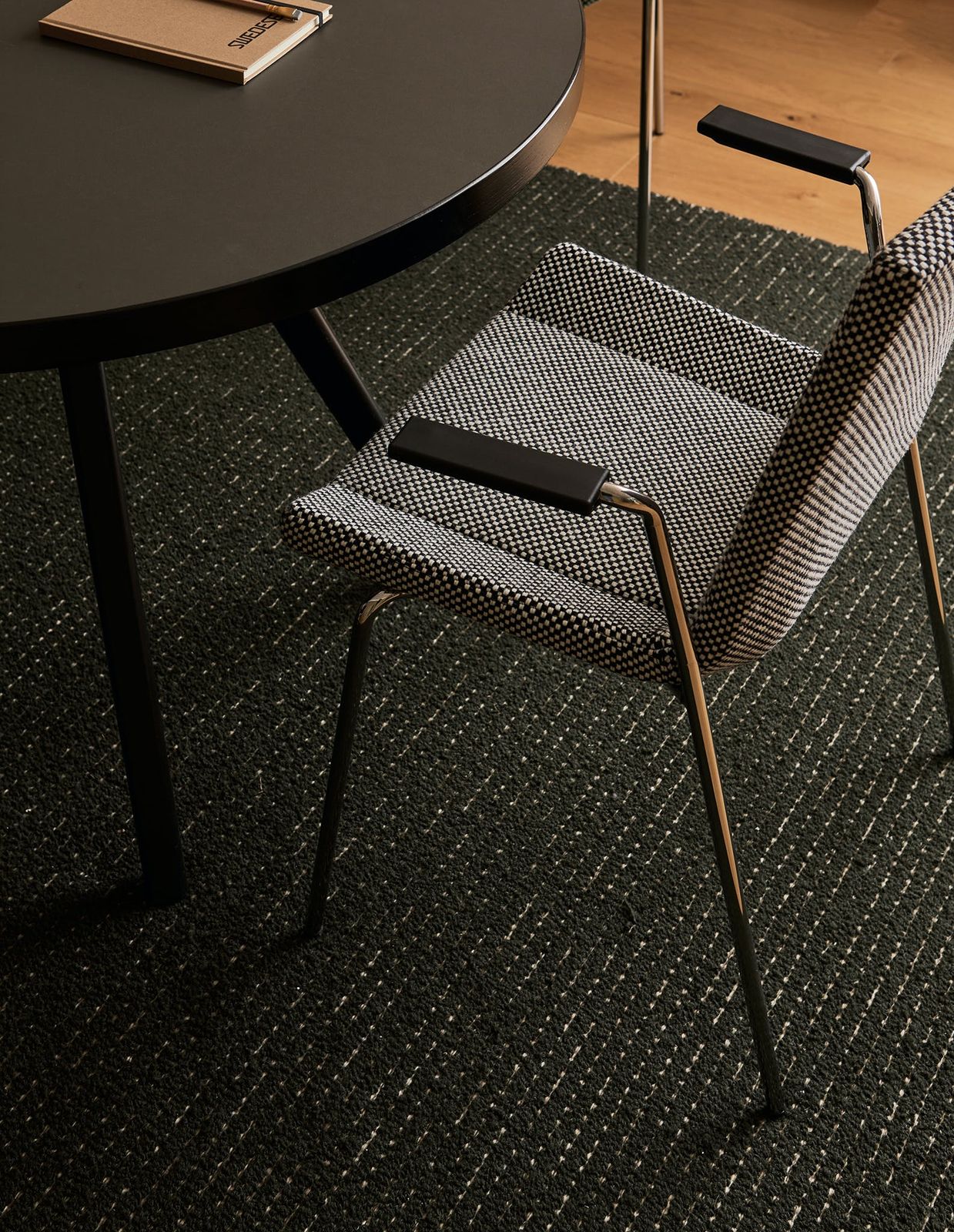 Happy stackable upholstered arm chair by Swedese
