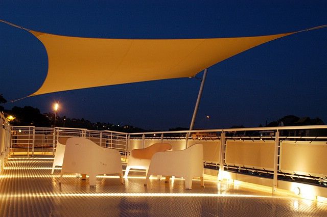 Ingenua shade sail provides shade on a private boat by Umbrosa