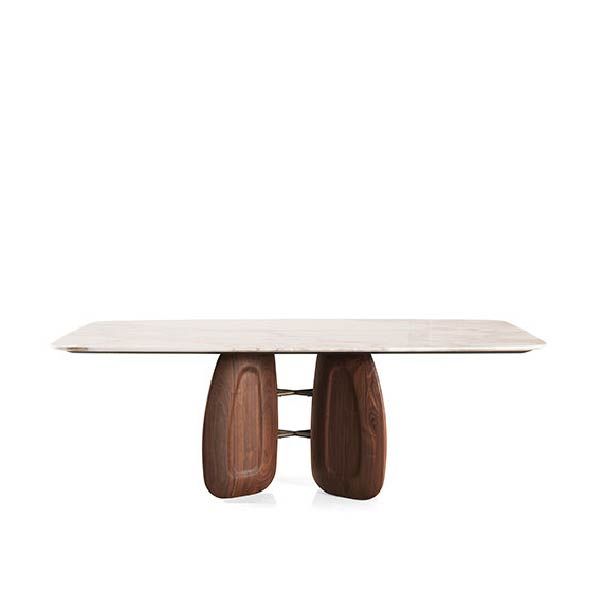 Marble top dining table with a modern design by Zanaboni