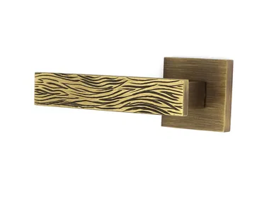 VITTORIA - Brass door handle on rose by Fama International