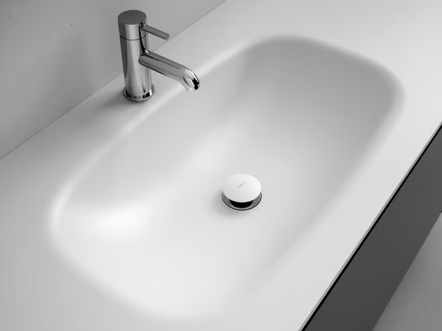 G1 - Corian® washbasin with integrated countertop by INBANI