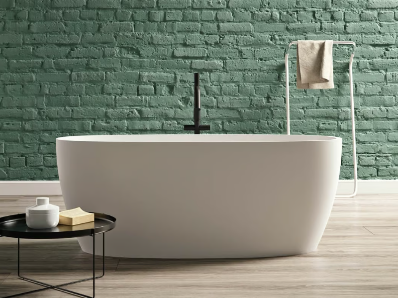 PORTOFINO - Freestanding oval Kstone bathtub by Karol