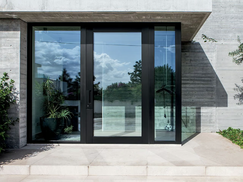 NOVA - Pivot glass entry door by OIKOS VENEZIA