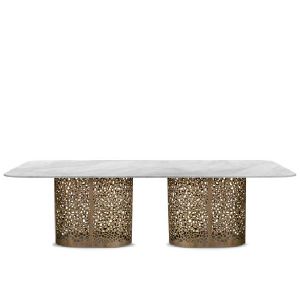 Dining table supported by perforated bronzed metal cylinders - Table by Zanaboni