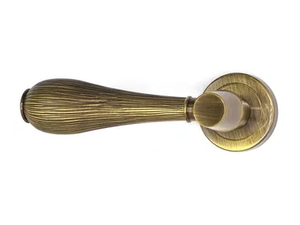 HARMONY - Brass door handle on rose - Finishes accessories by Fama International