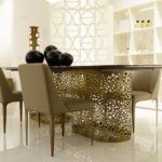 Dining table supported by perforated bronzed metal cylinders by Zanaboni - view 5