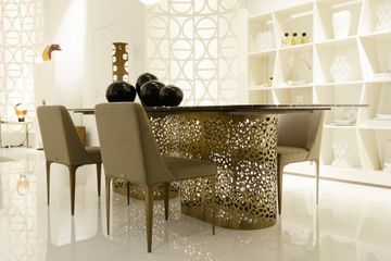 Dining table supported by perforated bronzed metal cylinders by Zanaboni - view 4