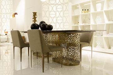 Dining table supported by perforated bronzed metal cylinders by Zanaboni - view 6