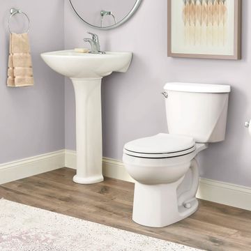 Reliant Two-Piece 1.28 gpf/4.8 Lpf Standard Height Round Front Toilet with Seat by American Standard - view 6