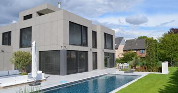Trespa® Meteon® Naturals exterior cladding | Stone‑look façade panels by TRESPA INTERNATIONAL