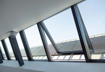 Shed roof | modular skylights and photovoltaic panels by Velux Commercial - view 8