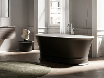 DEKÒ - Freestanding oval Mineralux Stone bathtub by DISENIA