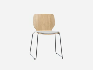 NIM - Sled base stackable wood veneer chair with integrated cushion by INCLASS