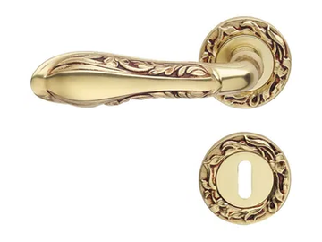 LIBERTY - Chromed brass door handle on rose with lock by LINEA CALI'