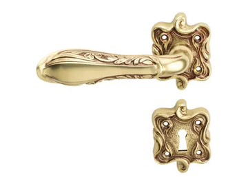 LIBERTY - Chromed brass door handle on rose with lock by LINEA CALI'
