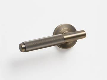 LINEAR - Brass door handle on rose by Lo & Co Interiors
