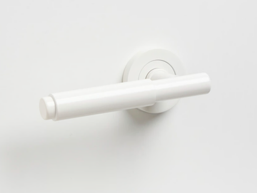 LOLA - Brass door handle on rose by Lo & Co Interiors
