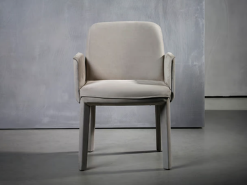 MINNE - Upholstered fabric chair with armrests by Piet Boon