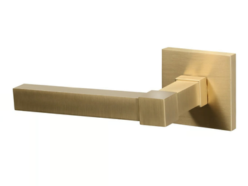 LUXEMBOURG - Brass door handle on rose by Quincalux