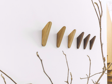 CUT - Wall-mounted solid wood coat rack by Schönbuch
