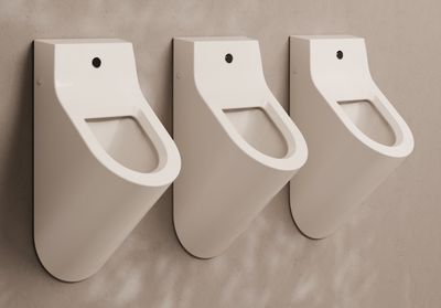 Form wall hung urinal with photo-cell