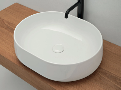 CIOTOLA - Oval countertop ceramic washbasin _ COLAVENE