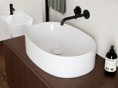 SKINNY - Oval countertop ceramic washbasin _ Scarabeo Ceramiche